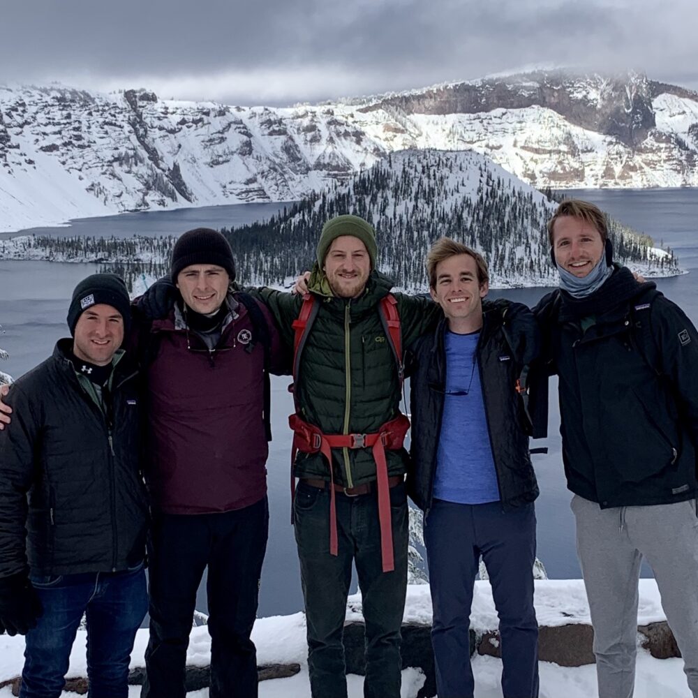 Tyba team in front of snow capped mountains